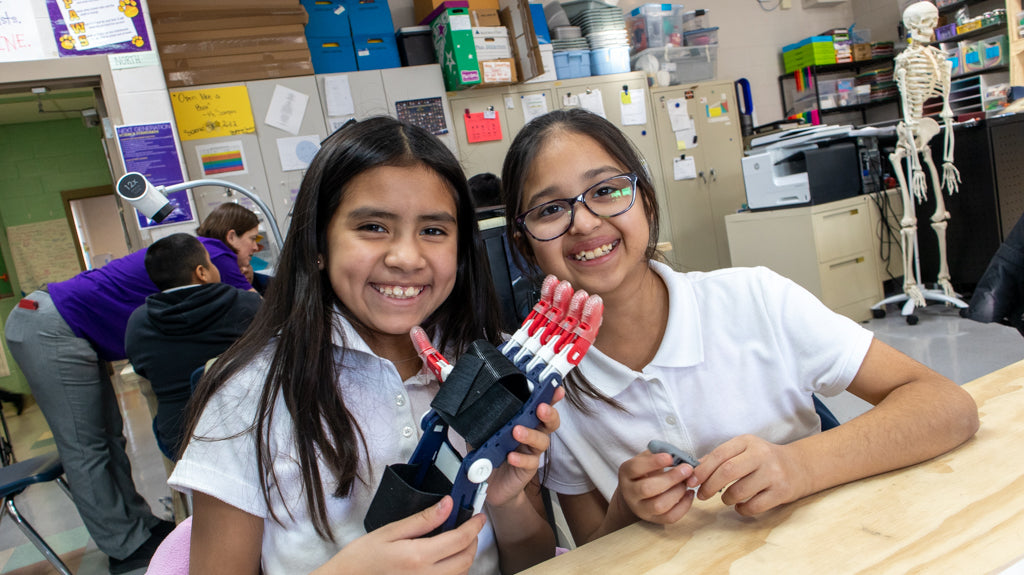 Students create free 3D Printed e-NABLE hands in the classroom to give to those in need at Peck Elementary School in Chicago.