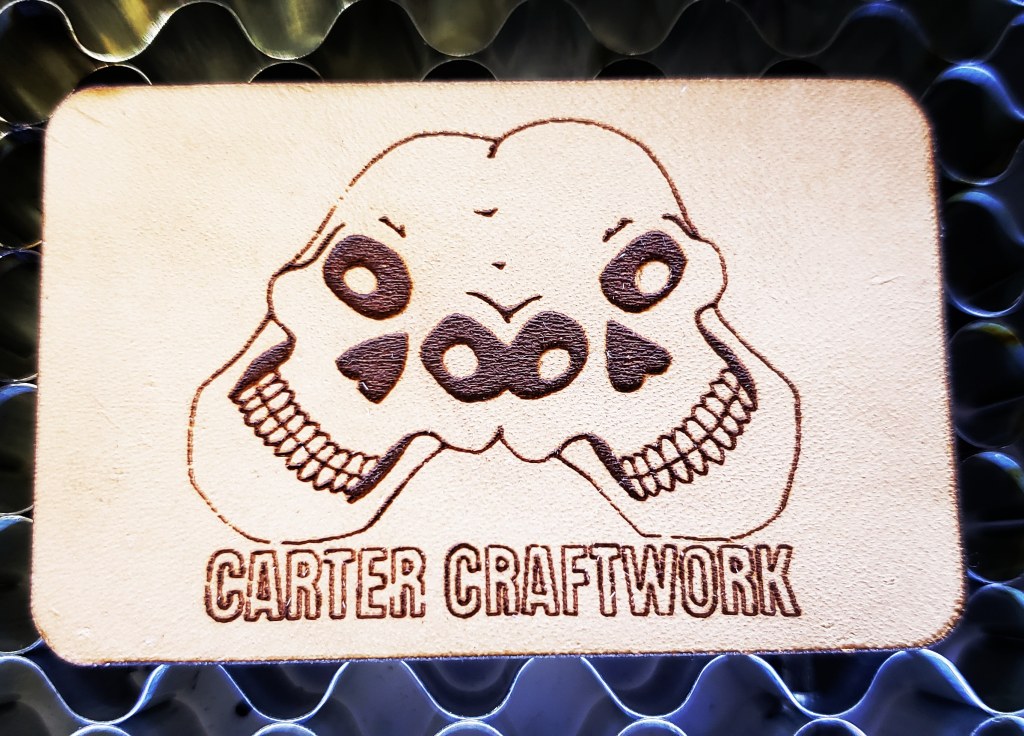 Double skull design on leather by Carter Craftwork