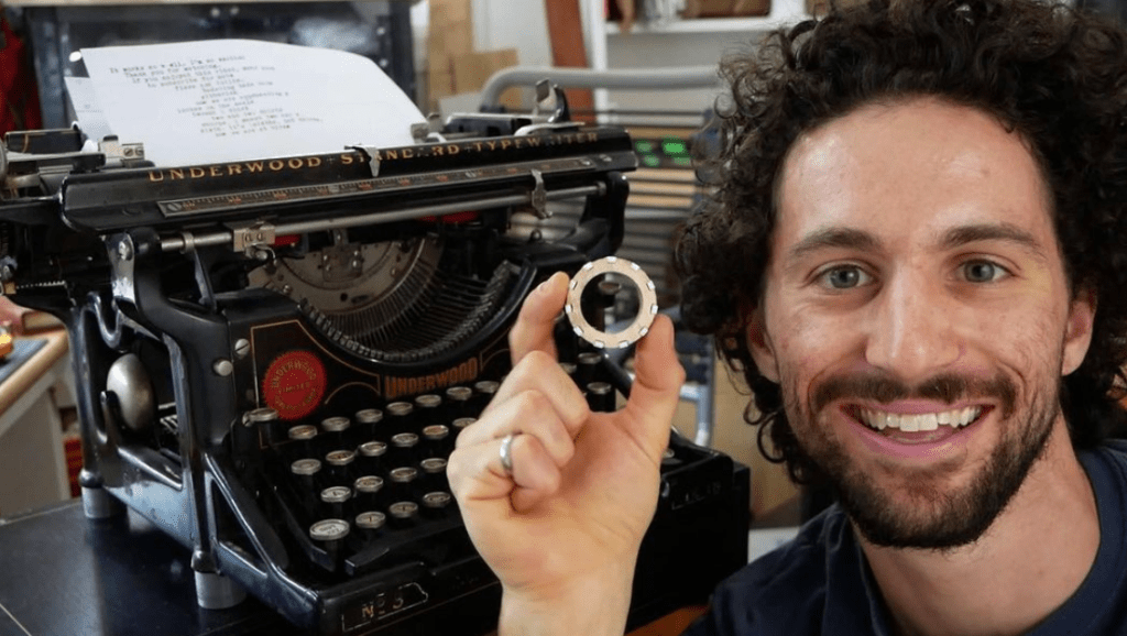 Morley Kert with a 3D printed part for an antique typewriter