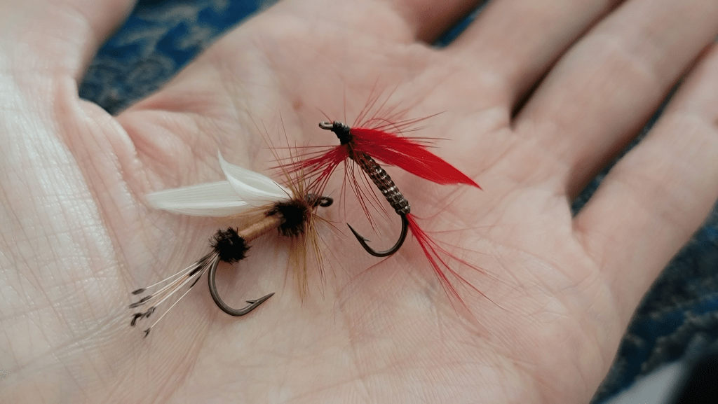 Fly fishing tied flies in a hand