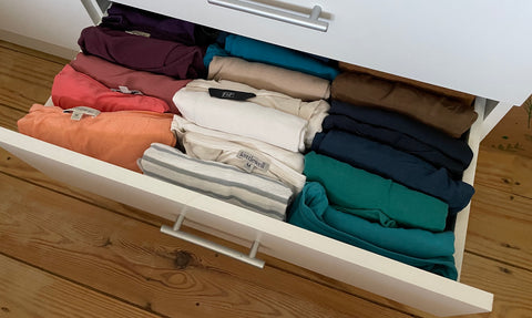 A drawer of folded clothes