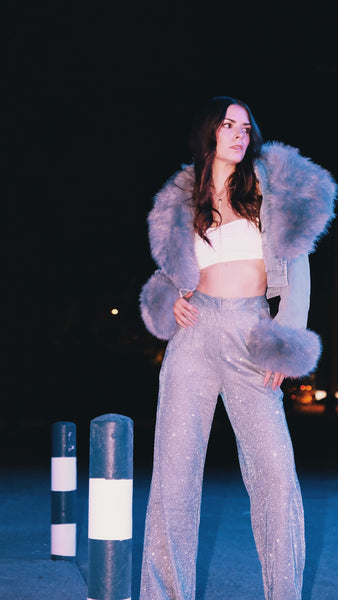 kelsey in a fur jacket and glitter pants