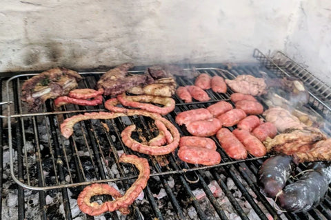 Asado on open grill cuts of meat