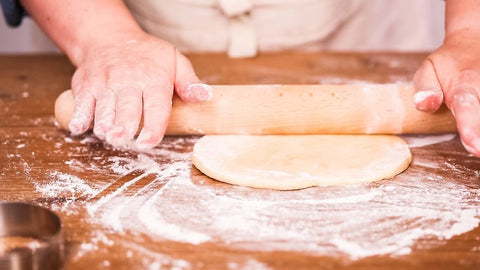 Rolling out dough for empanadas
