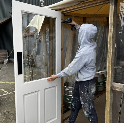 Euan hanging the door to the Marquee