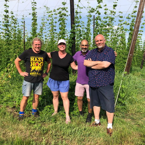 Tour guides in hop garden