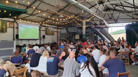 People watching the Womens Euros final in the Hangar at the brewery