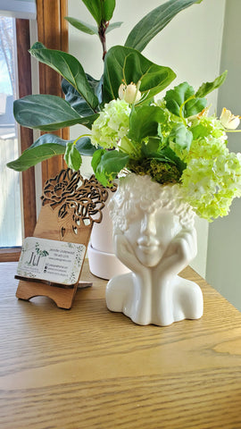 Female face flower vase