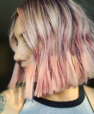 pink hair tinsel holiday hair 