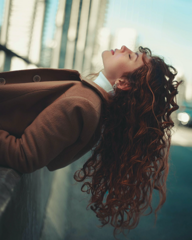 curly hair woman in the city