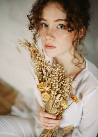 curly hair girl with flowers 