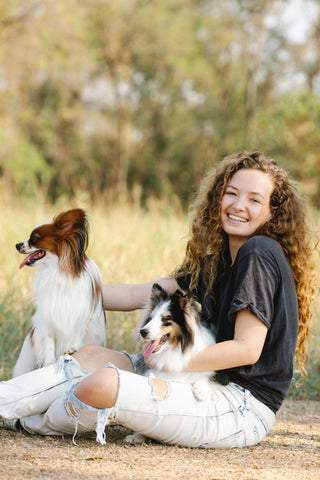 curly hair woman with dogs