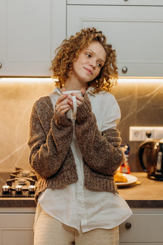 curly hair woman with coffee mug