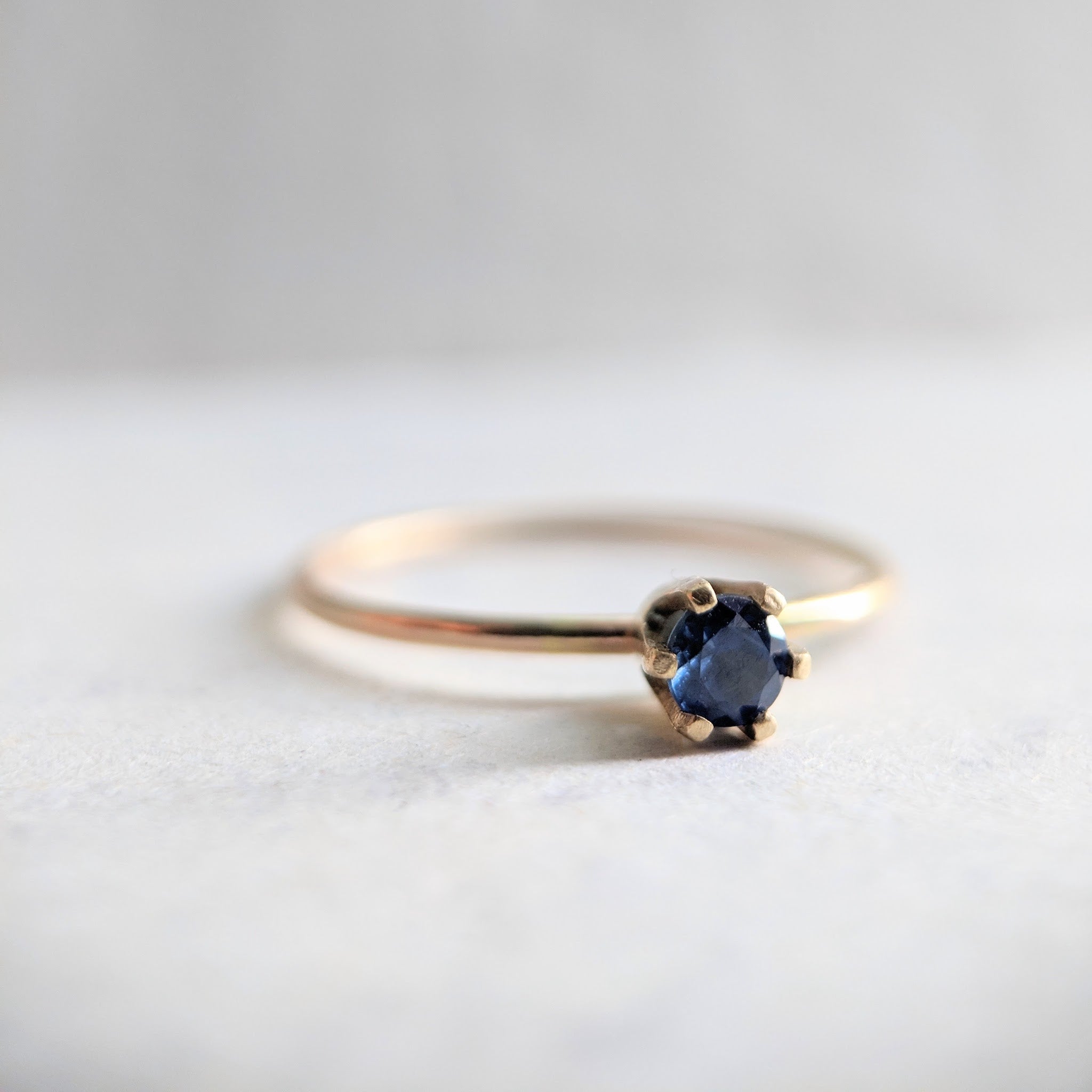 "Aster" dainty birthstone ring in London blue topaz