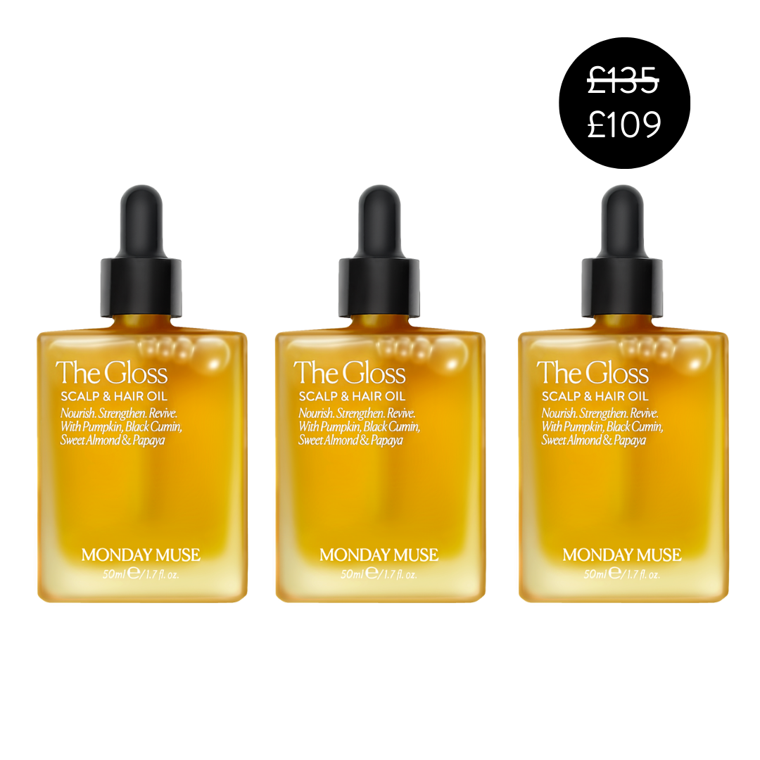 Three bottles of 'The Gloss' scalp and hair oil by Monday Muse.