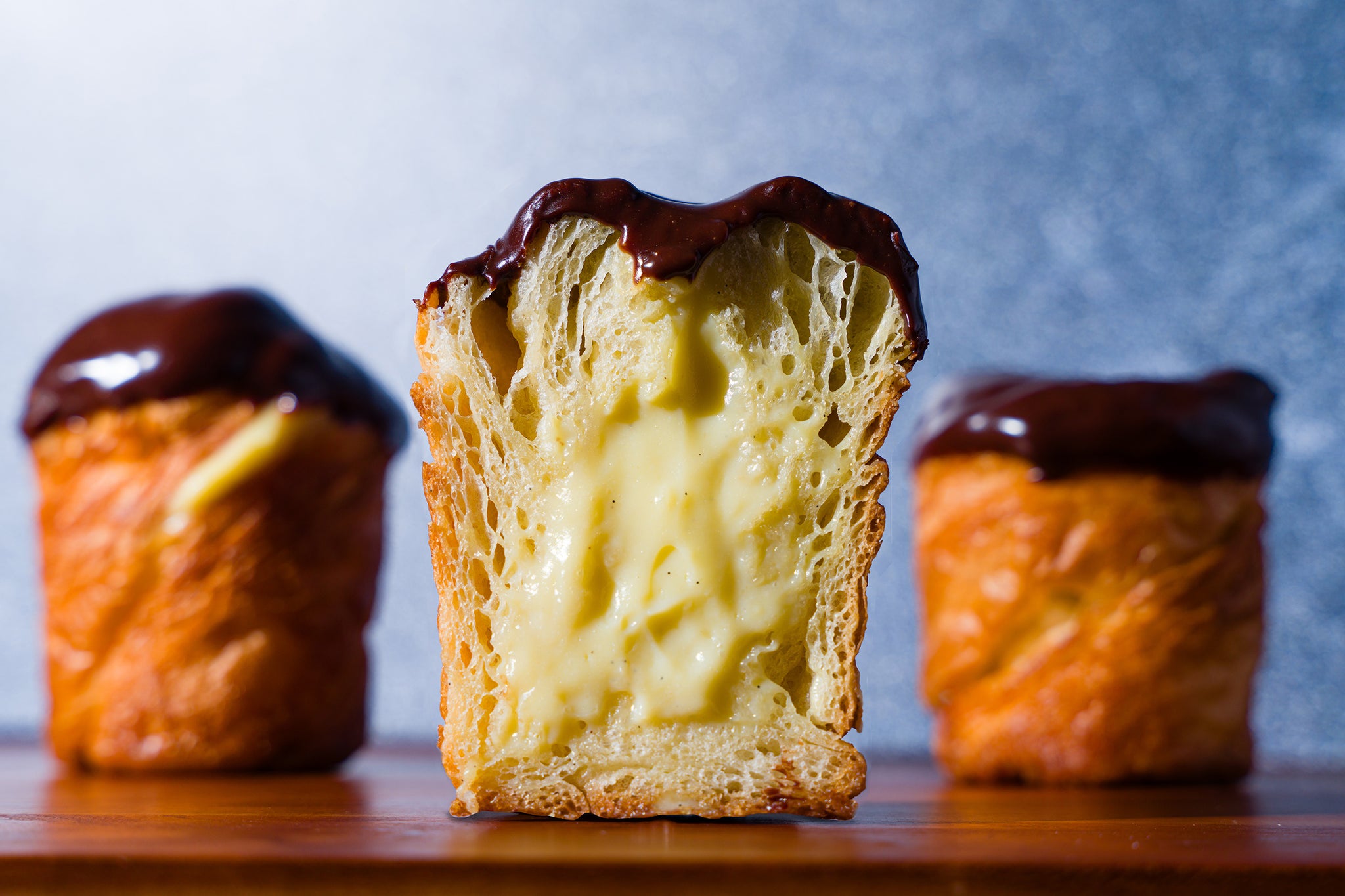 Cross section of a Boston Cream Cruffin filled with pastry cream