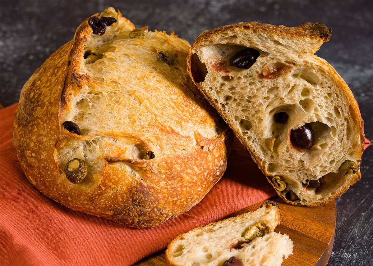 A loaf of olive sourdough bread