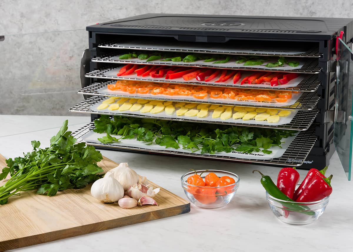 Sahara dehydrator with slices of vegetables inside