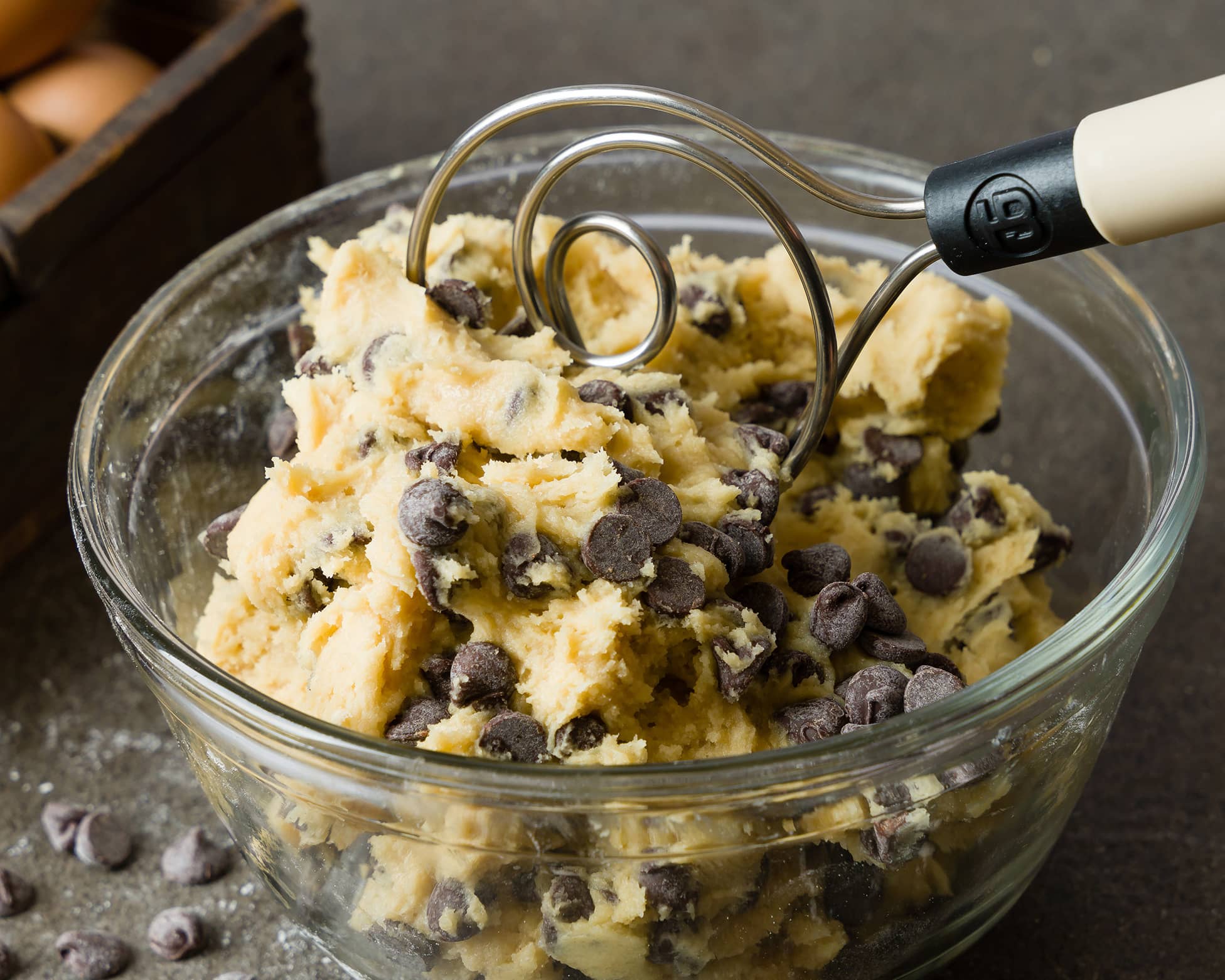 Dough Whisk and cookie dough in a glass bowl