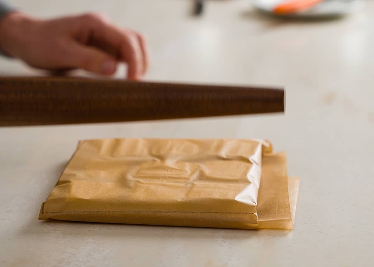Small pieces of butter block between two parchment paper