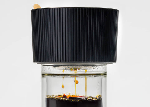 Pour-over Coffee Dripper, coffee being dripped into a glassware