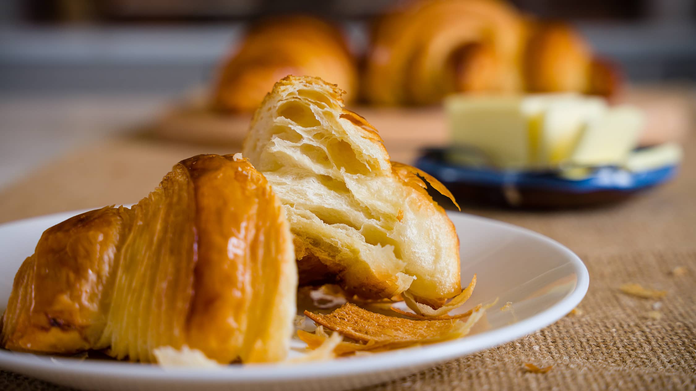 flaky croissants on a plate