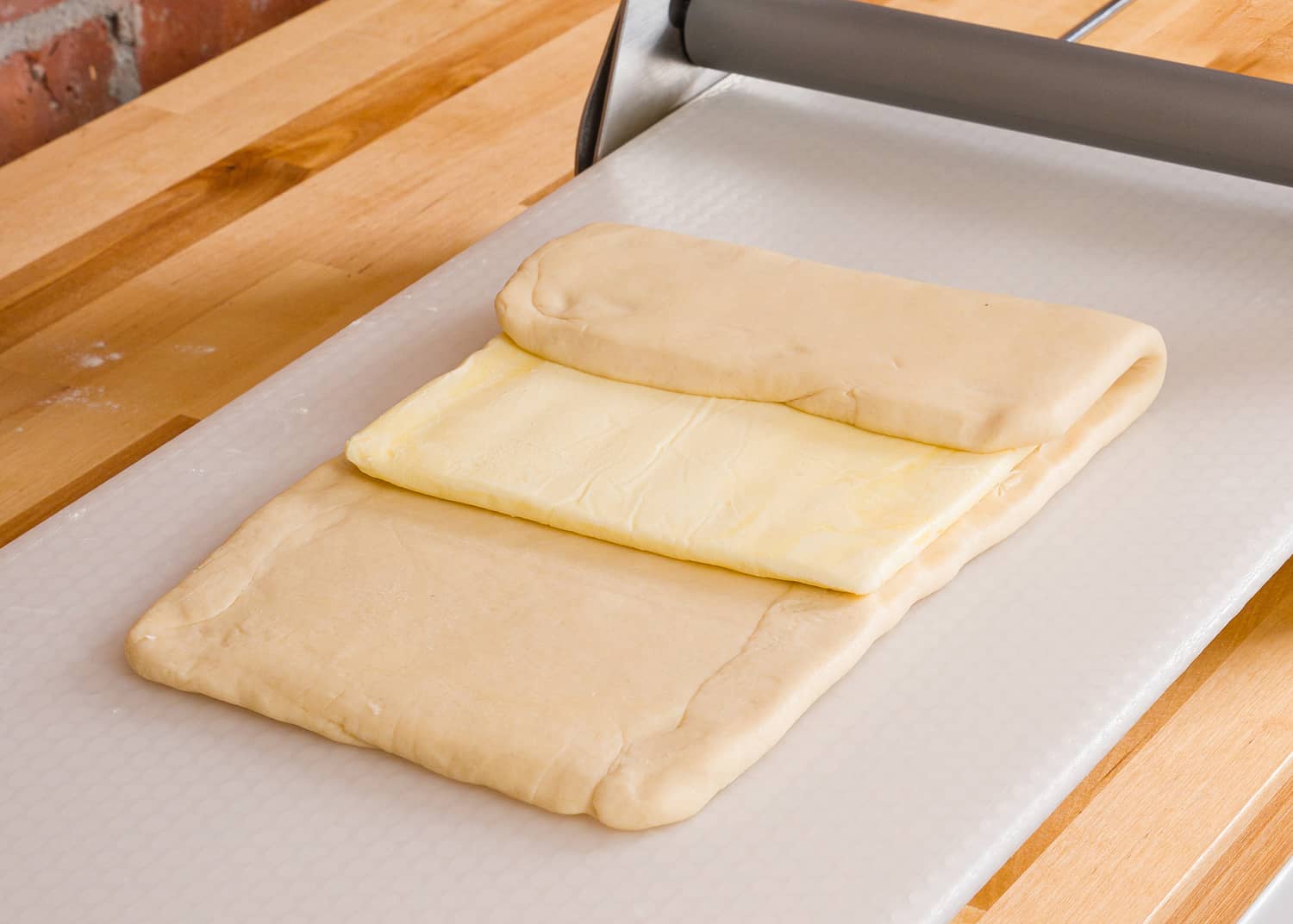 Locking in the butter block for croissant dough