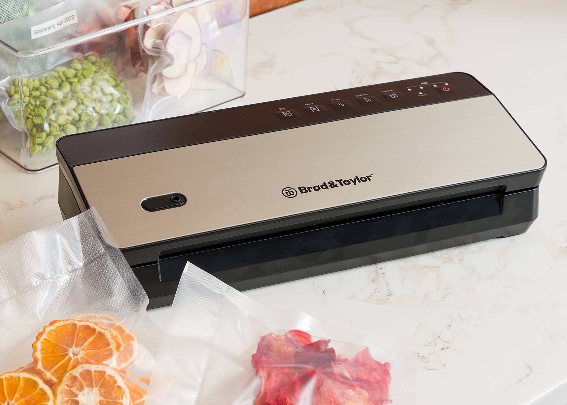 Cordless Vacuum Sealer with sealed fruit and vegetables.