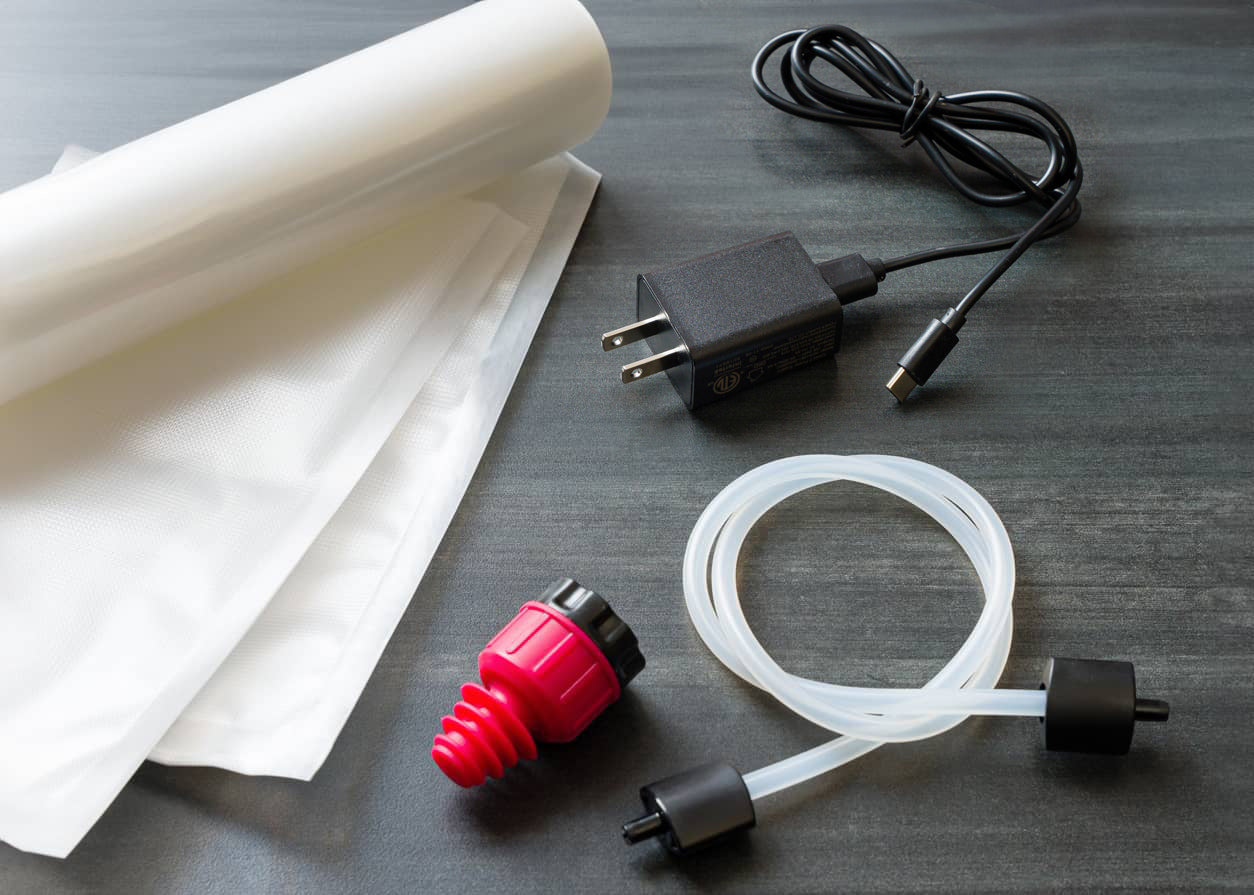 What's included: bags, USB charger, wine stopper and canister tube