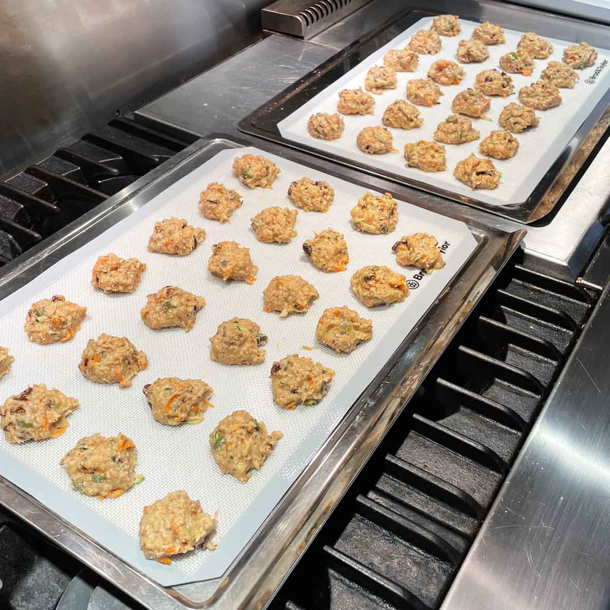 48 cookies dough spoon on to baking sheets