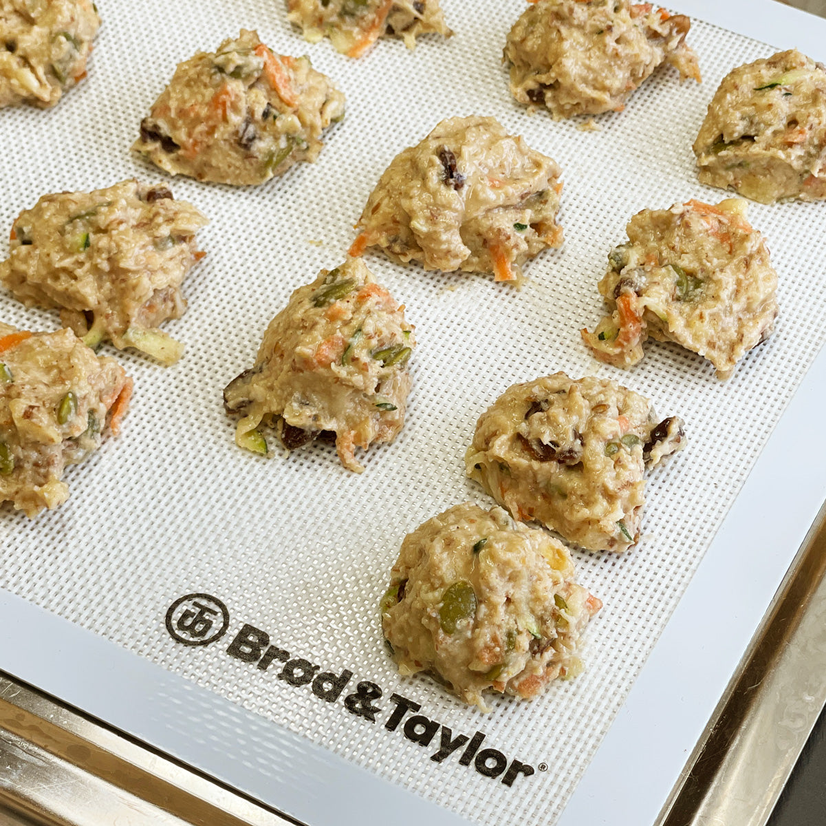 Close-up shot of the cooke dough on a baking sheet