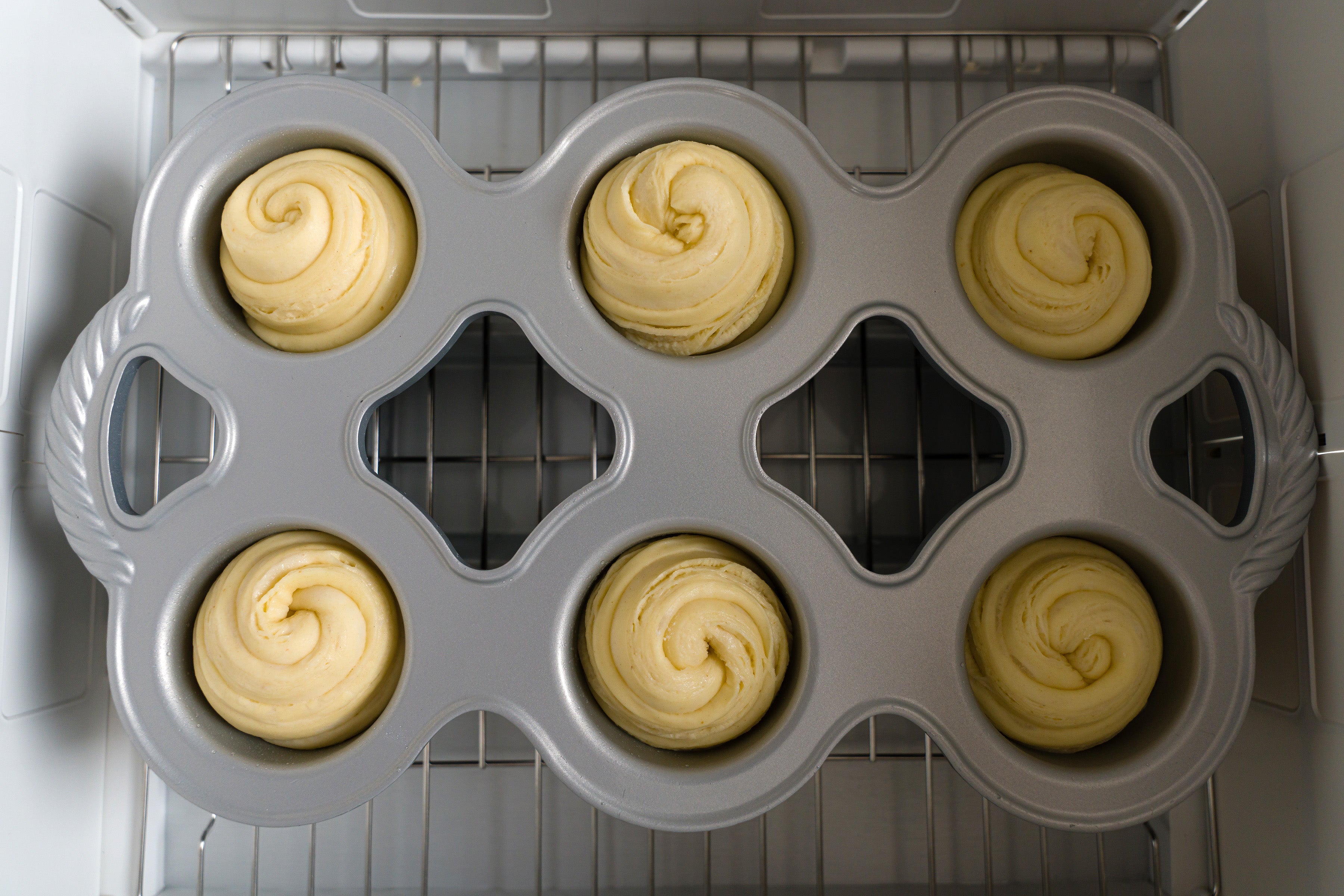 Cruffins fully risen and ready to be baked