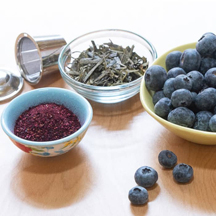 Fresh blueberries and dehydrated blueberry leaves