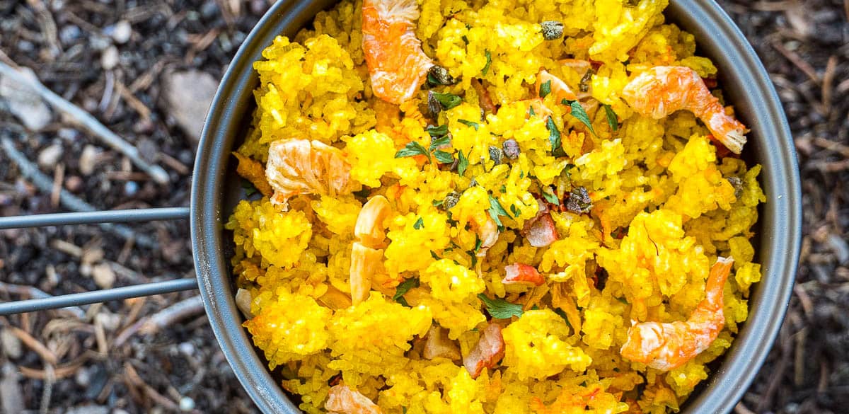 This dehydrated seafood paella is some serious next level gourmet backpacking food. Shrimp, crab , olives, capers, and veggies in a bed of golden saffron rice.