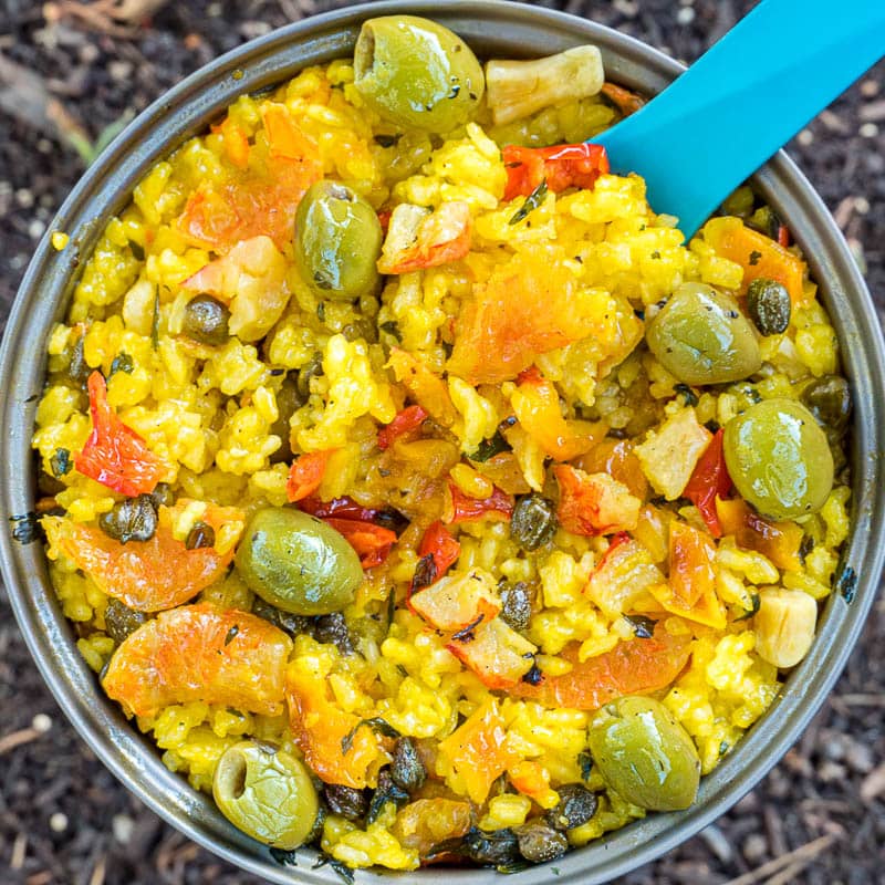 This dehydrated seafood paella is some serious next level gourmet backpacking food. Shrimp, crab , olives, capers, and veggies in a bed of golden saffron rice.