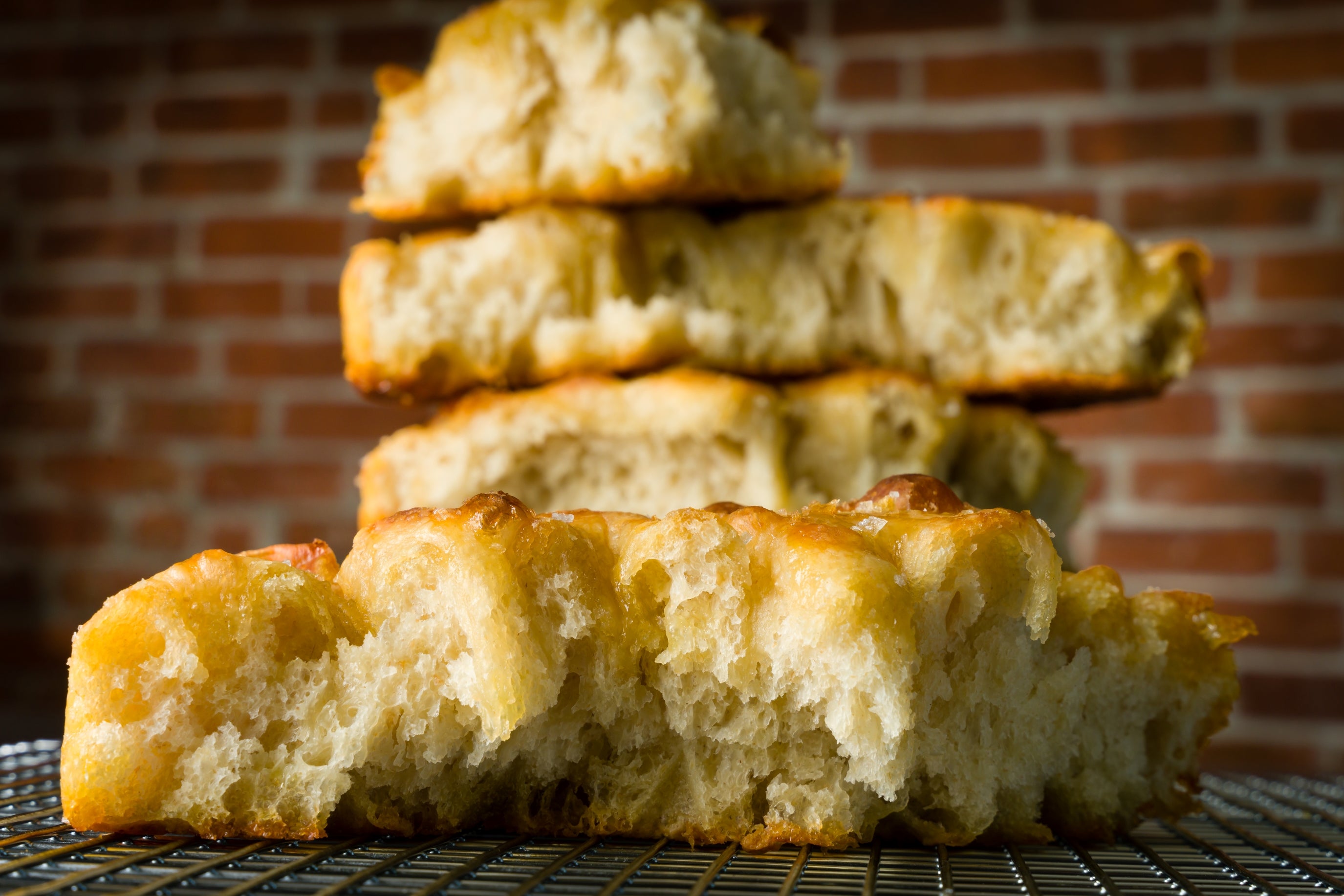 a stack of torn pieces of honey sea salt focaccia 