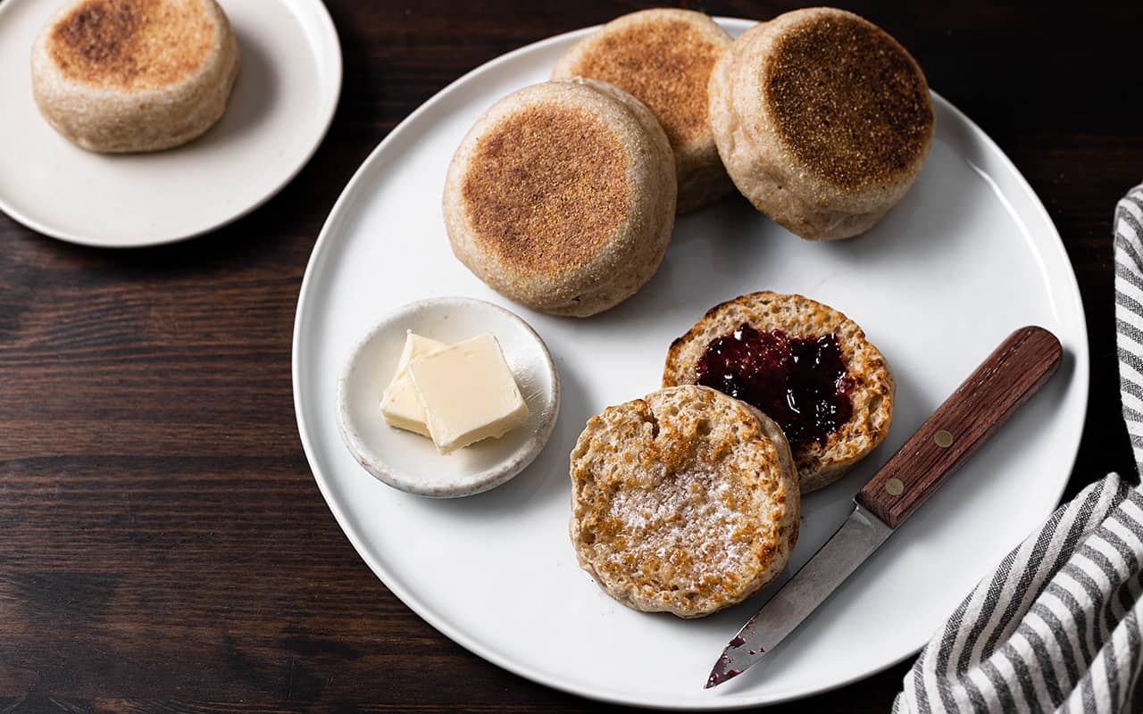 Sourdough English Muffins with butter and blueberry jam