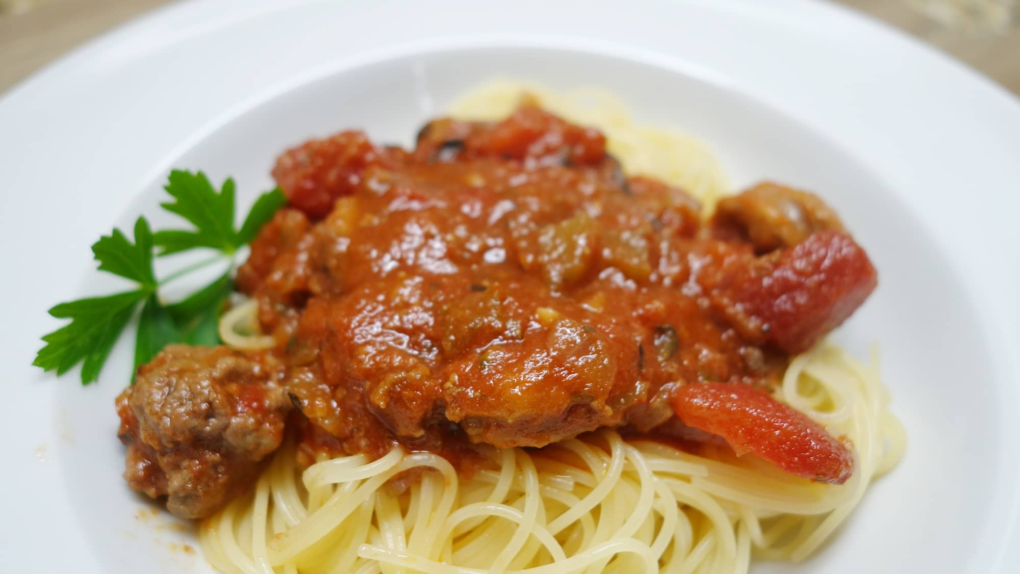 Slow cooked italian meat sauce on spaghetti