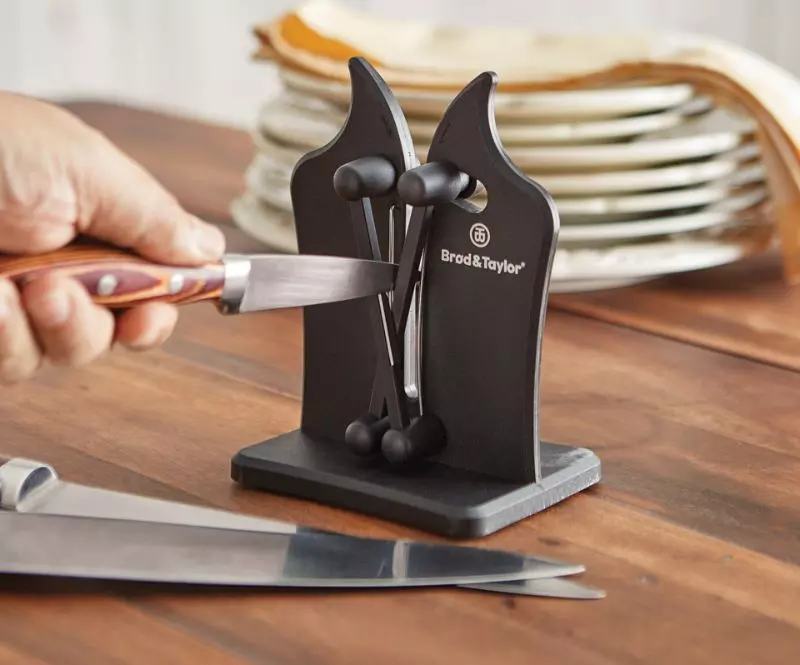 Knife being sharpened on knife sharpener