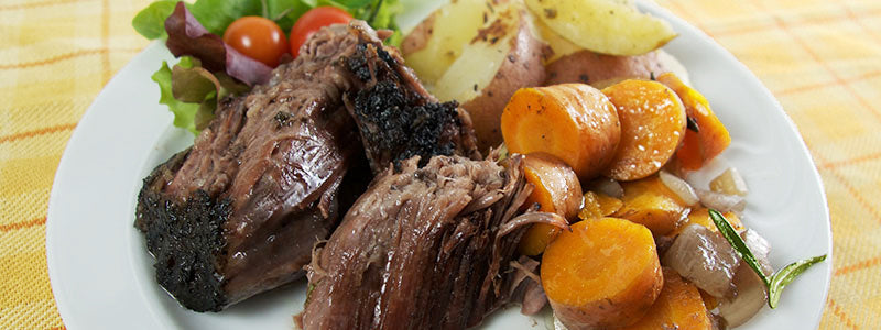 Slow cooked chuck roast and potatoes and carrots