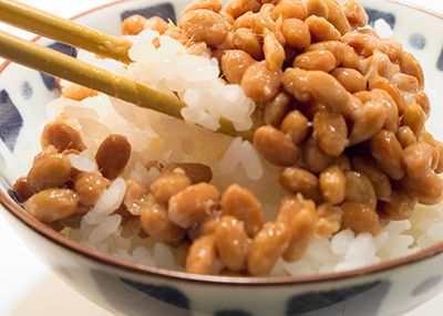 Natto served on a bowl of steamed sushi rice