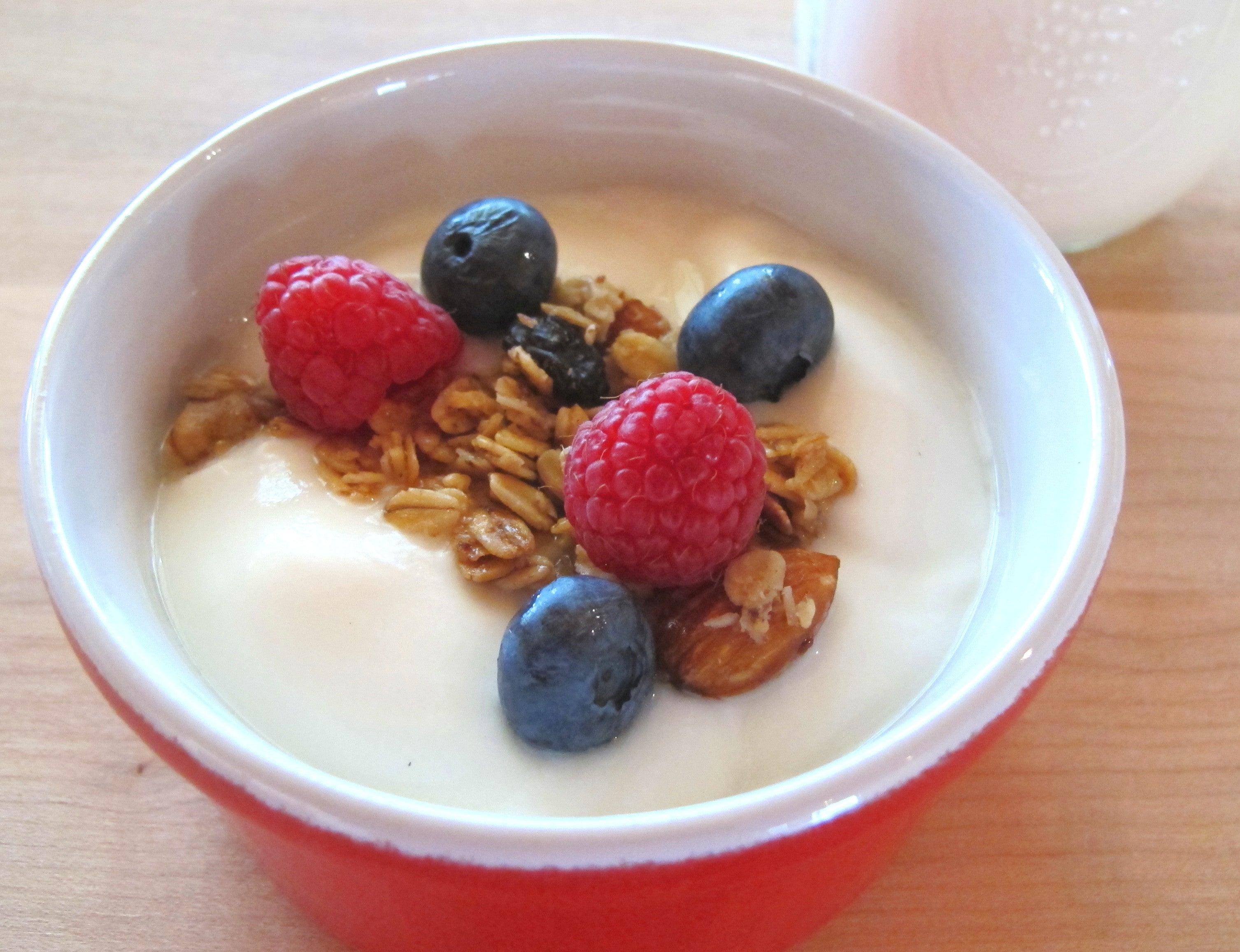 A bowl of yogurt with berries and granola