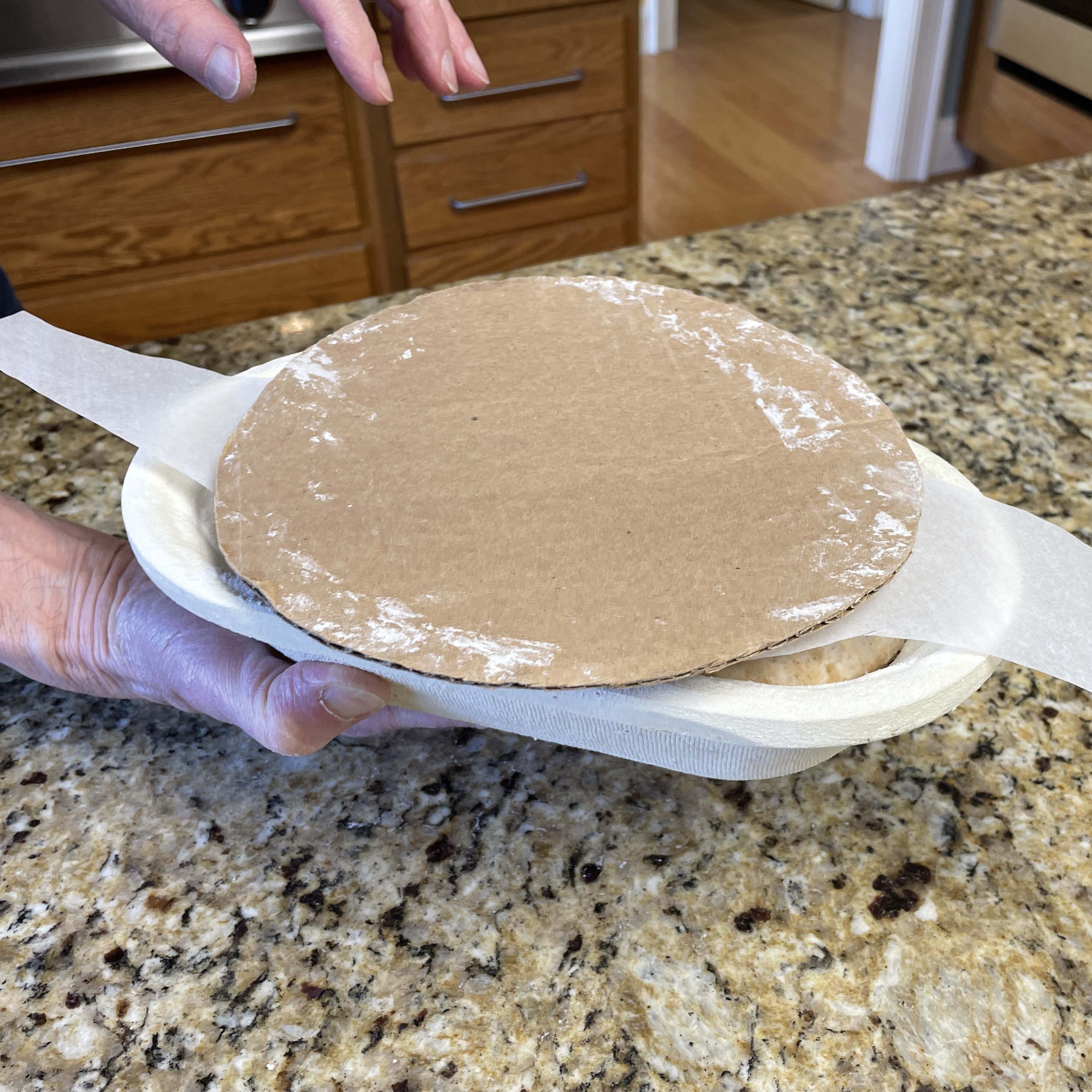 A stiff piece of cardboard placed against the parchment