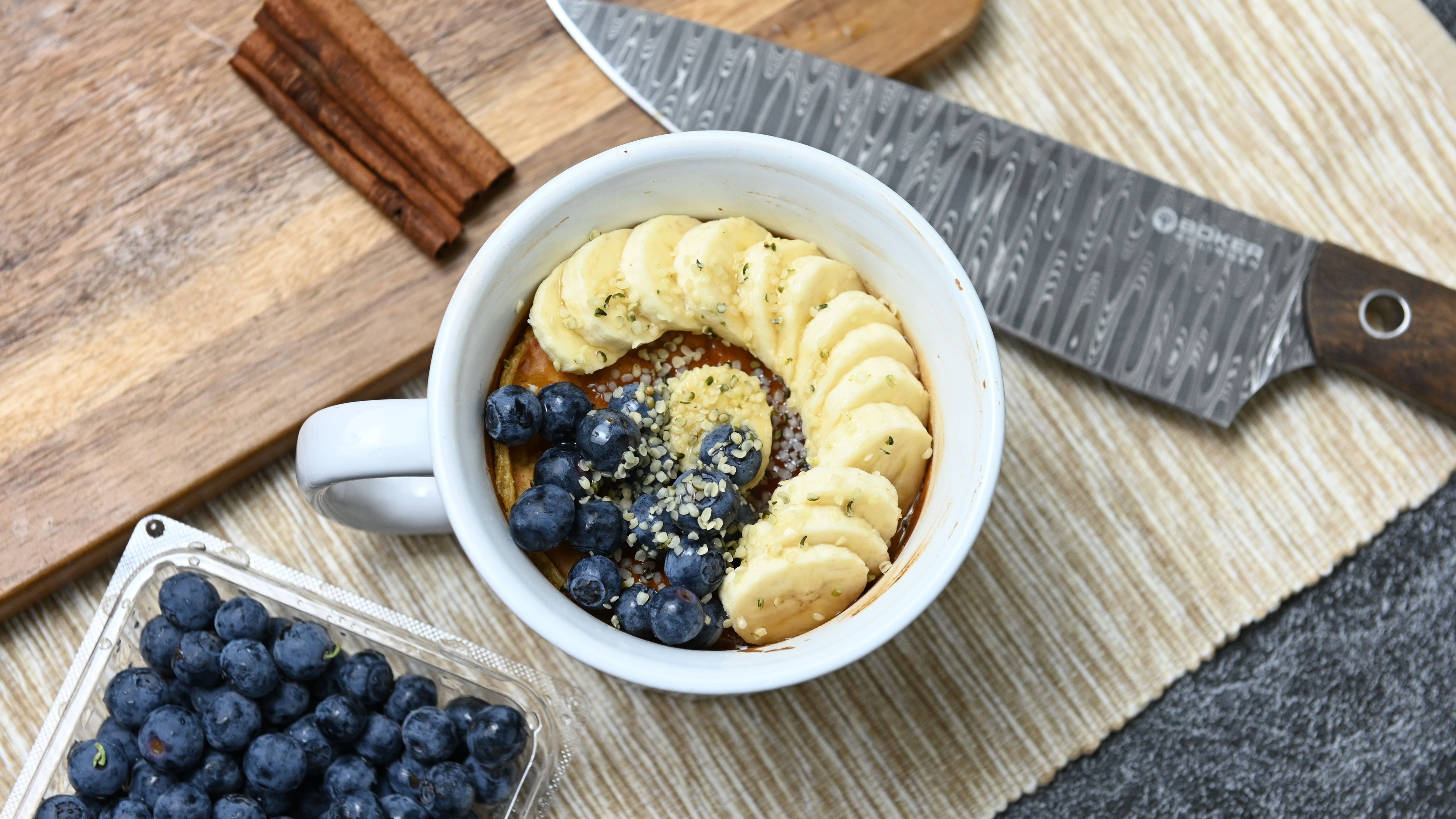 Banana bread topped with fresh blueberries and bananas