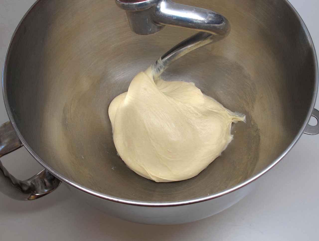 Mixing the cinnamon roll dough in a mixer