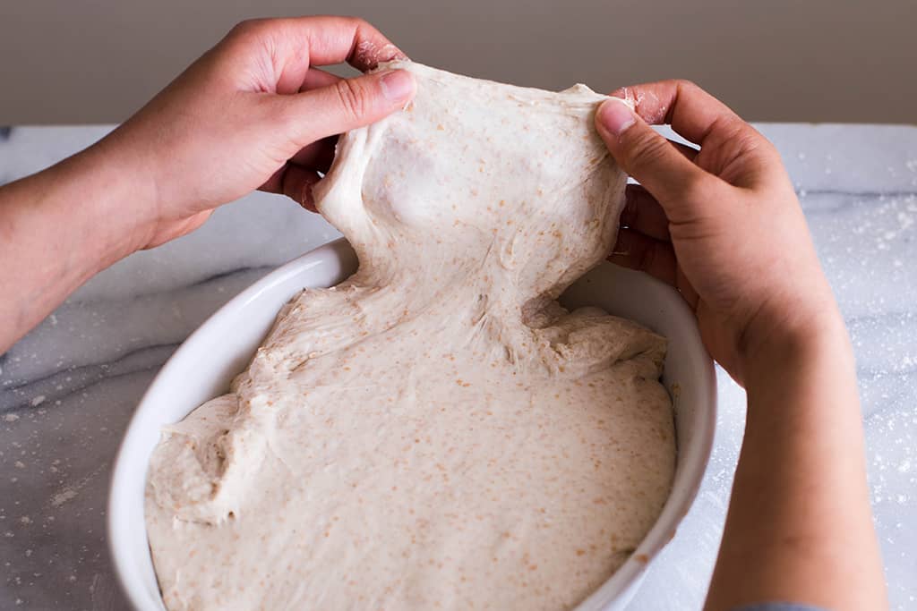 Gently stretching the dough