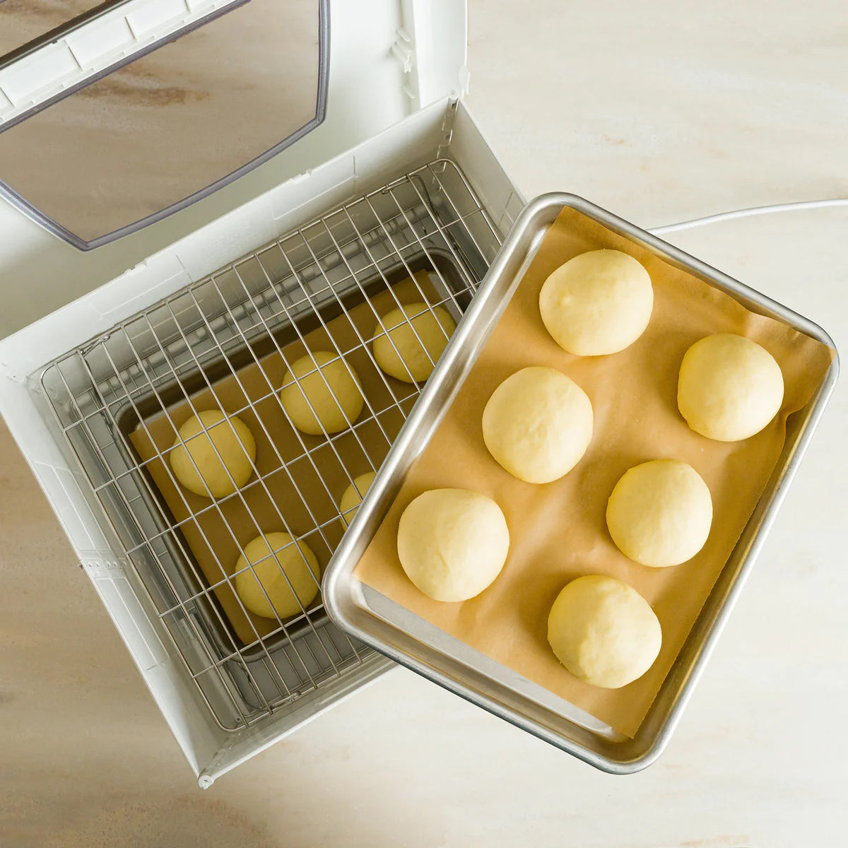 Dough on a sheet into the Proofer