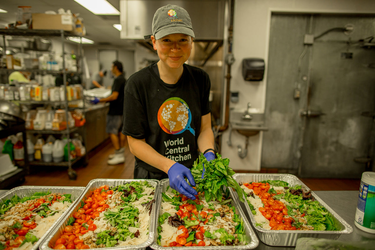 World Central Kitchen staff is preparing salad mix