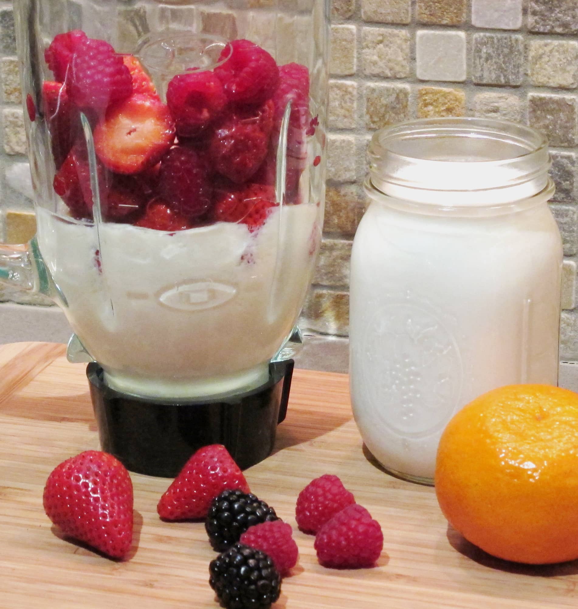 soy yogurt and berries in a blender