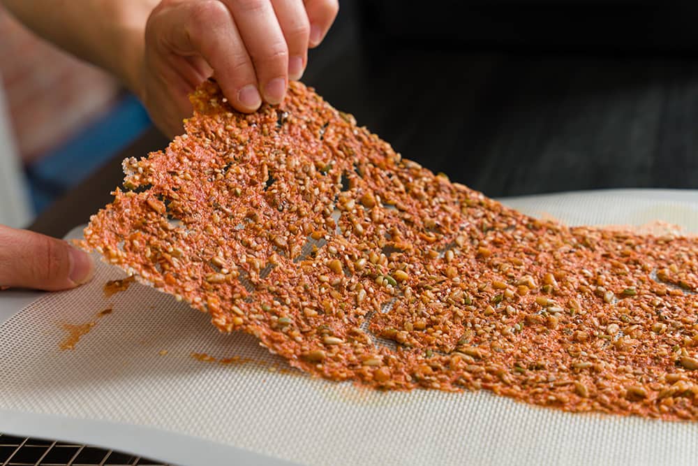 A sheet of dehydrated tomato cracker